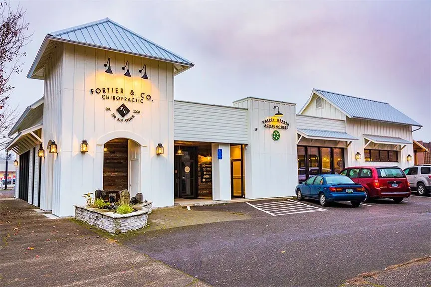 Fortier & Co. Chiropractic at dusk, lamps lit, 220 5th Ave SW, Albany, Oregon