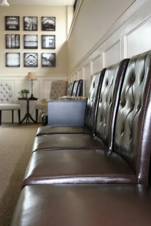 Tufted leather seating in the Fortier Chiropractic waiting room